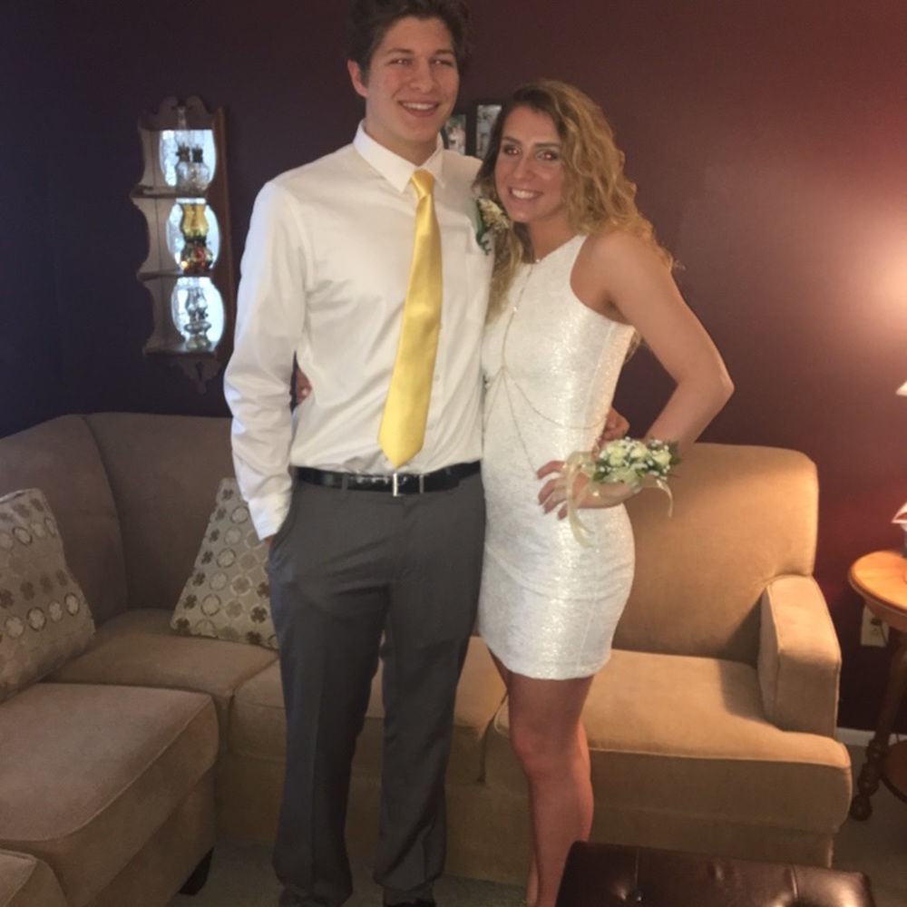 white tight fit dress with gold and silver accents